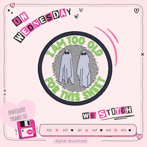 May include: A digital embroidery file with a pink and black design. The design features the text "ON WEDNESDAY" and a circular emblem with two ghost figures and the phrase "I AM TOO OLD FOR THIS SHEET". The words "WE STITCH" are also present.