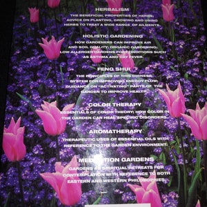 May include: A book cover with a pink and purple floral design. The text on the cover reads "Herbalism", "Holistic Gardening", "Feng Shui", "Color Therapy", "Aromatherapy", and "Meditation Gardens".
