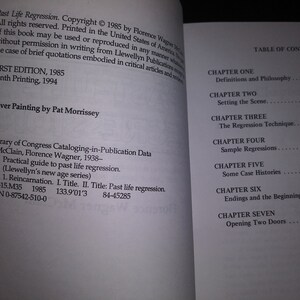May include: A book titled "Past Life Regression" by Florence Wagner McClain. The book cover features a white background with black text. The book is a practical guide to past life regression and includes information on reincarnation. The book was published in 1985 and is part of Llewellyn's New Age Series.