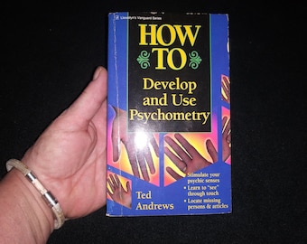 May include: A blue book with the title "How To Develop and Use Psychometry" by Ted Andrews. The book cover features a colorful image of hands and the text "Stimulate your psychic senses. Learn to "see" through touch. Locate missing persons & articles."