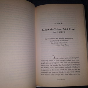 May include: Open book with a white background and black text. The text reads "Follow the Yellow Brick Road: Prep Work". The book is open to a page with a quote from Henry David Thoreau and a paragraph about witches.