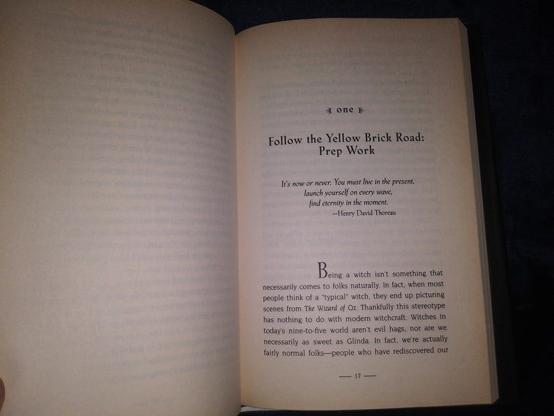 May include: Open book with a white background and black text. The text reads "Follow the Yellow Brick Road: Prep Work". The book is open to a page with a quote from Henry David Thoreau and a paragraph about witches.