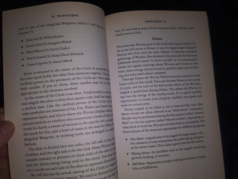 May include: A page from a book titled "The Book of Spirit" with a section on "Symbols of Spirit" and "Esbats". The text discusses the significance of the full moon in Wiccan rituals and the different types of magic that can be performed during each phase of the moon.