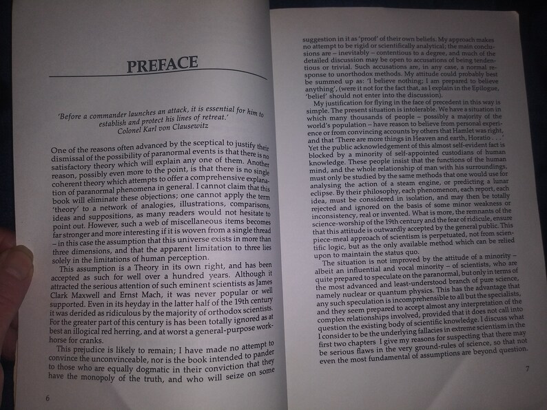 May include: A book titled "Preface" with a quote from Colonel Karl von Clausewitz about military strategy. The text discusses the possibility of paranormal events and the limitations of human perception.