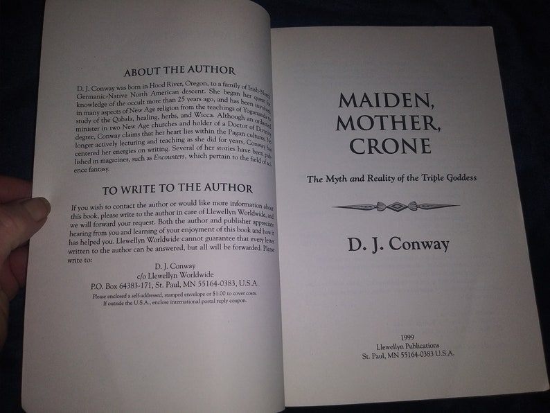 May include: A book cover with the title "Maiden, Mother, Crone: The Myth and Reality of the Triple Goddess" by D.J. Conway. The book cover is white with black text and a decorative design.