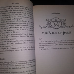 May include: Open book with a white background and black text. The title of the book is "The Book of Spirit". The book is about Wiccan practices and the five elements of the universe: Air, Fire, Water, Earth, and Spirit.