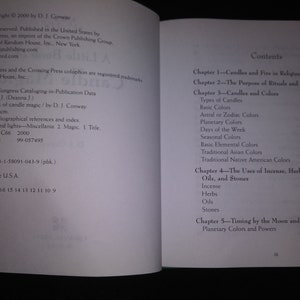 May include: Open book with text on both pages. The left page has copyright information, including the title "A little book of candle magic" by D.J. Conway. The right page displays the table of contents, listing chapters on candles, rituals, and magic.