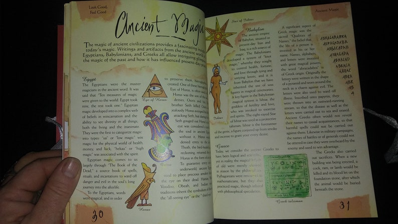 May include: Open book with colorful illustrations and text about ancient magic. The book covers Egyptian, Babylonian, and Greek magic. The text includes the words "Ancient Magic", "Egypt", "Babylon", and "Greece".