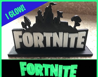 fortnite logo stand birthday cake topper desk or bedroom decoration for gamers glows in the dark our best seller - fortnite chest for sale