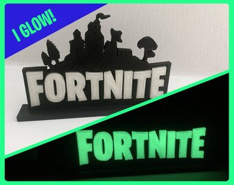fortnite logo stand birthday cake topper desk or bedroom decoration for gamers glows in the dark our best seller - fortnite theme party city