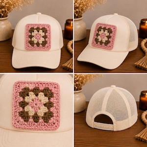 May include: A cream-colored baseball cap featuring a square crochet patch on the front. The patch displays a granny square pattern in shades of pink, brown, and beige. The cap includes a mesh back panel and an adjustable snapback closure.