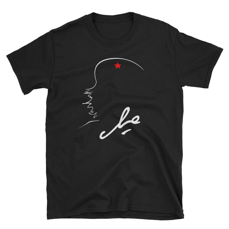 May include: Black t-shirt with a white line drawing of a profile with a red star above it and the word "Che" written in white below it.