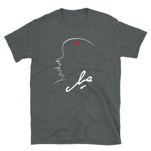 May include: A dark heather grey t-shirt with a white outline of a person's face and the word "فهد" in white Arabic script. A small red star is above the person's head.