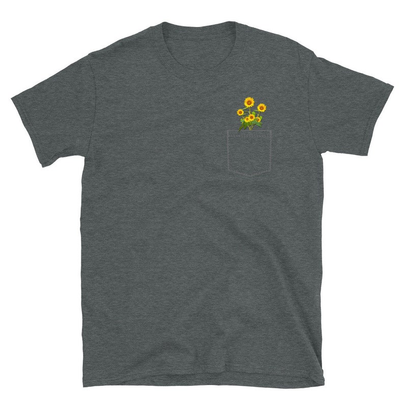 May include: A dark heather grey t-shirt with a pocket featuring a small bouquet of yellow sunflowers.