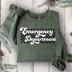 May include: A green sweatshirt with the text "Emergency Department" in a retro white font on a black and white checkered background.