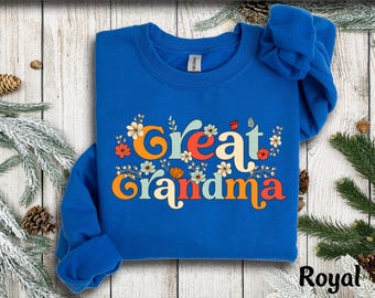 May include: A royal blue sweatshirt with a floral design and the text "Great Grandma" in colorful retro lettering.