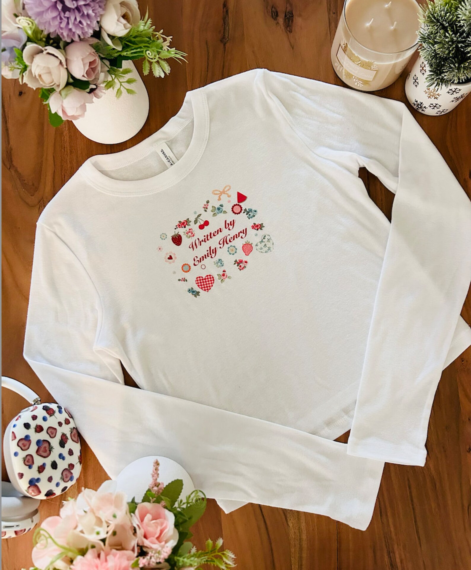 Written by Emily Henry White Long Sleeve Baby Tee Cottagecore