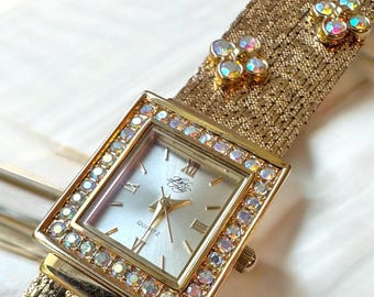 Vintage Ladies Kirks Folly Gold Tone and Crystal Rectangle Face and Flower Strap Bracelet Watch with Original Booklet Inserts
