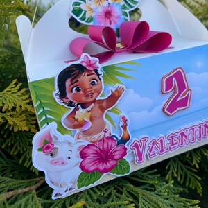 May include: A white party favor box with a pink bow, tropical flower accents, and a cartoon illustration of a girl, pig, and rooster. The box has the number 2 and the name "Valentina" on it.