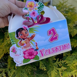 May include: A white party favor box decorated with a cartoon image of a girl, a pig, and a rooster. The box has a pink bow and the name "Valentina" with the number "2". Colorful floral stickers adorn the top.