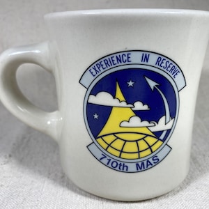 710th MAS Military Airlift Squadron Coffee Mug &quot;Experiencia en Reserva&quot; Travis AFB California C-141A Starlifter