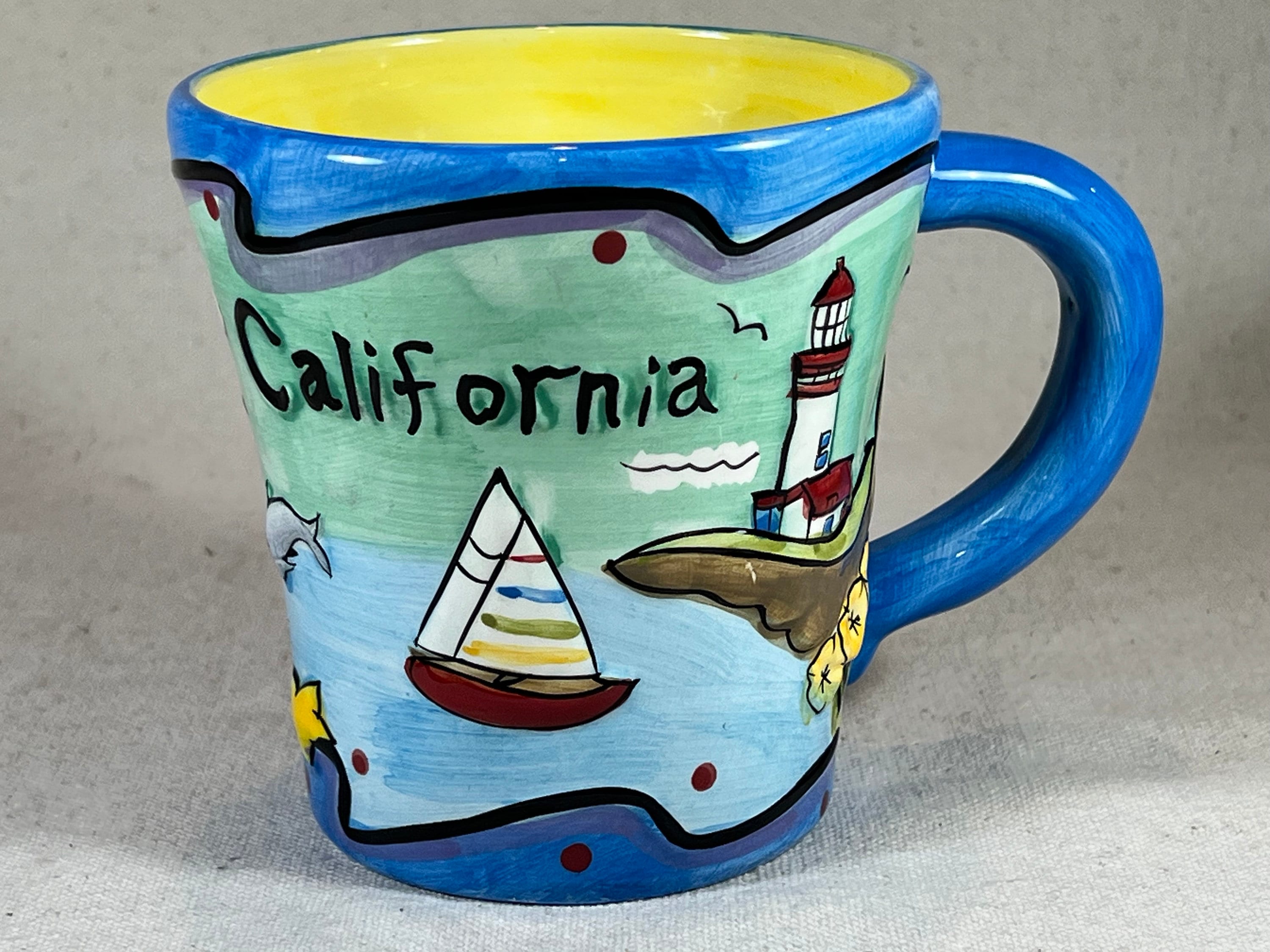 Embossed Hand-Painted California Souvenir Coffee Mug Lighthouse Sailboat Golden Poppies Yellow Contrast Interior