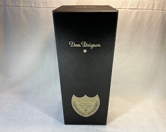 Champagne Dom Perignon millésime 2012 Brut boîte vide écusson or sur fond noir