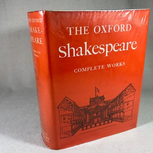 May include: A red hardcover book titled "The Oxford Shakespeare Complete Works". The cover features a black and white illustration of the Globe Theatre.