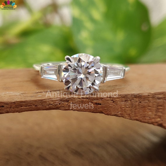 1.87 TW Round and Tapered Baguette Three Stone Moissanite Ring