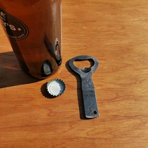 Hand forged bottle opener