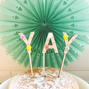 YAY Birthday etched wooden cake toppers handfinished with bright pom poms