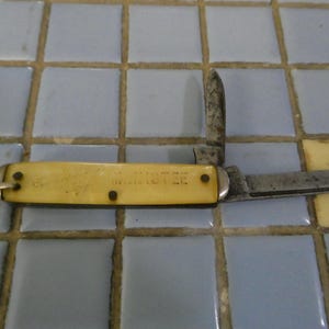 vintage kent 2 blade pocket knife made in 1950&#39;s by camillus knife co. souvenir of manistee, michigan celluloid handle used condition
