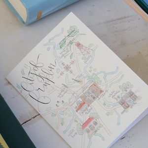 May include: A hand-drawn map of the City of Franklin, Tennessee, with a light blue, green, and brown color scheme. The map shows the location of various buildings and landmarks, including the Franklin Theatre, the historic courthouse, and the Carter House.