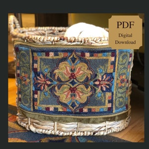 May include: A decorative basket with a detailed, embroidered panel. The panel features a central floral design in shades of red, blue, and gold on a gray background. The text "PDF Digital Download" is in the upper right corner.