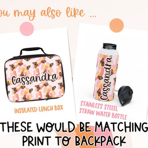 May include: A pink and orange lunchbox and water bottle with a butterfly and rainbow pattern. The lunchbox and water bottle are personalized with the name "Cassandra".
