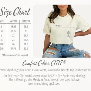 May include: A size chart with measurements in inches for t-shirts, next to a person wearing a cream-colored t-shirt and blue jeans. The chart lists sizes S through 3XL, with width and length measurements. The shirt is Comfort Colors C1717.
