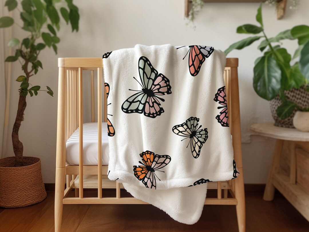 Butterfly embossed blanket in white