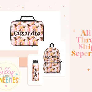May include: A personalized lunch bag, backpack, and water bottle set with a pink and orange butterfly and rainbow pattern. The set is personalized with the name "Cassandra".