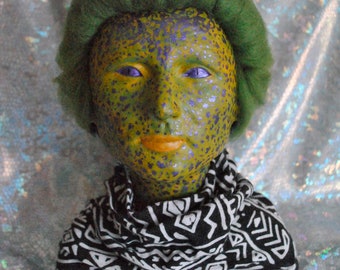 Alien bust sculpture made of clay and mixed media. Little green men art