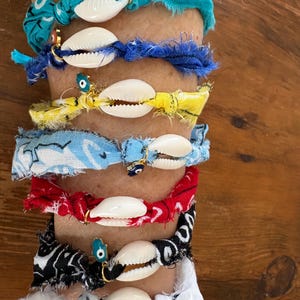 May include: A set of three ceramic mugs with a speckled, matte finish. The mugs are in shades of cream, light gray, and dark gray. Each mug has a simple, minimalist design, perfect for coffee or tea.