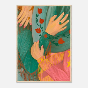 May include: A framed art print featuring an illustration of two sets of hands embracing. The hands are adorned with rings and bracelets. The figures are wearing a teal green shawl with red floral accents and a pink garment with yellow fringe.