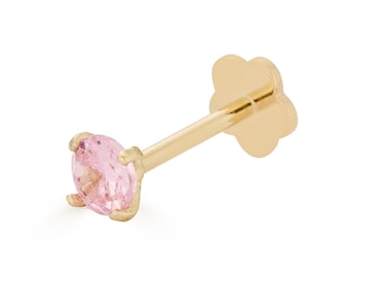 May include: A gold stud earring with a pink gemstone. The earring has a flower-shaped post.