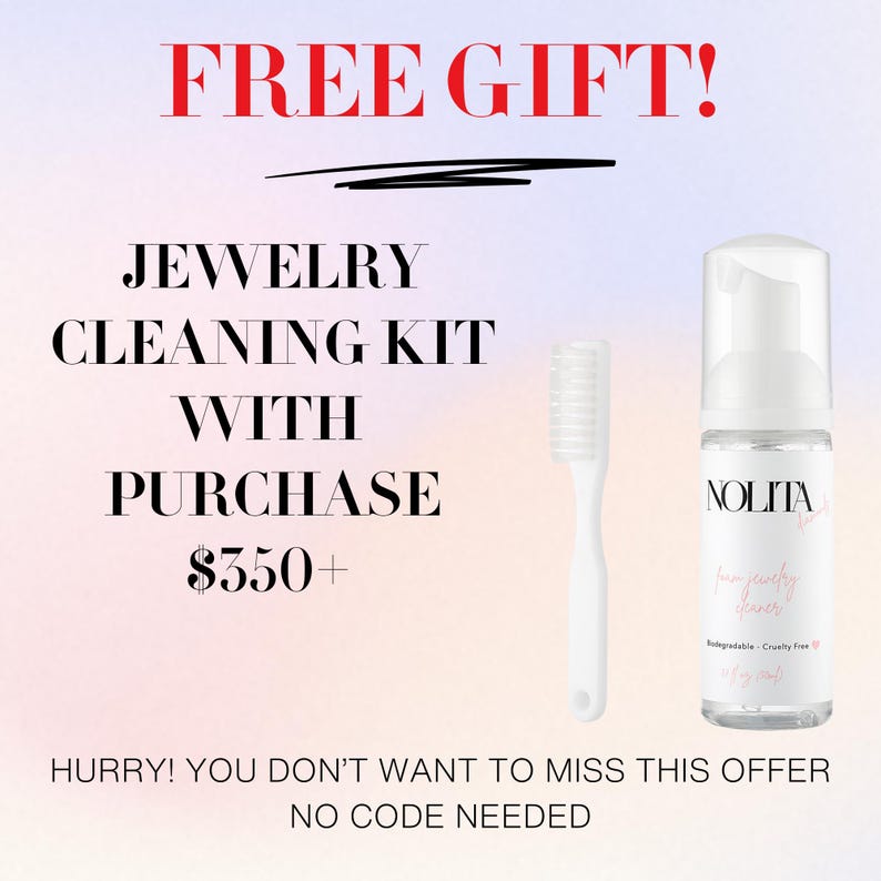 a white toothbrush next to a bottle of liquid