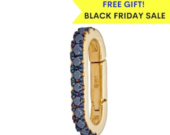 May include: Gold oval-shaped earring with a row of blue gemstones around the edge. The earring is a clasp that can be used to connect to other jewelry.