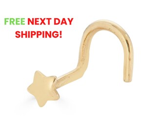 May include: Gold nose ring with a star-shaped charm.