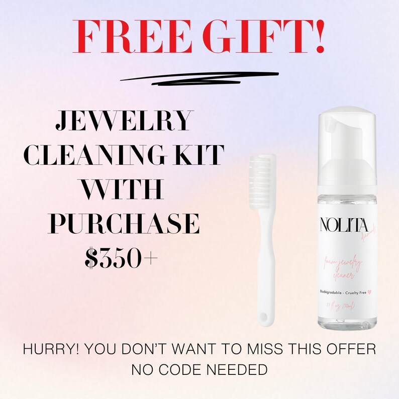 a white toothbrush next to a bottle of liquid
