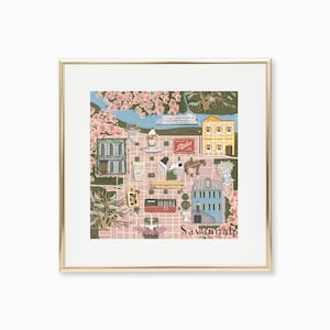 May include: A pink and green illustrated map of Savannah, Georgia, with a river, buildings, a horse-drawn carriage, a bus, and a boat. The text "Savannah" is at the bottom of the map.