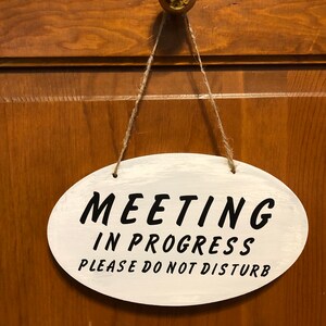 Meeting in progress please do not disturb. Wood hanging hand painted vinyl lettering Do not disturb sign. 8.5&quot; x 5&quot;.