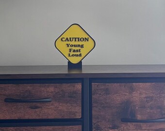 3D Printed Caution Young Fast & Loud, Fun Kids Room Decor, Playroom, Light Weight. 5.25" x 4.9" x .28" Stand Included.