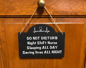 Do not disturb Night shift Nurse sleeping all day saving lives all night. Wood, Hand Painted, Vinyl lettering, Nurse door hanger, 7.5"x5.5".